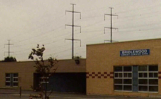 A photograph of the school appears here